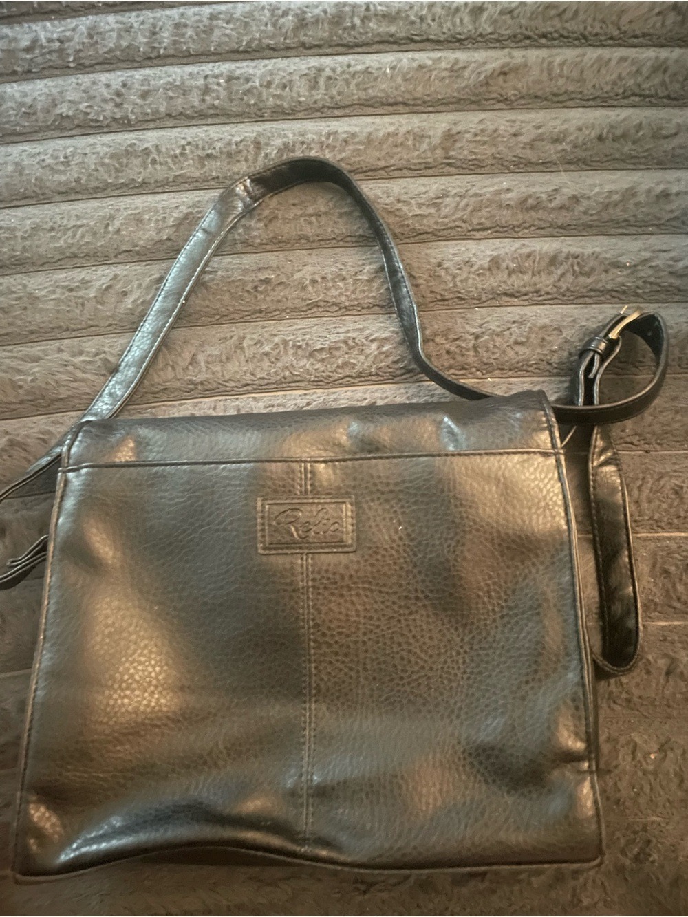 RELIC Erica black faux leather crossbody bag.